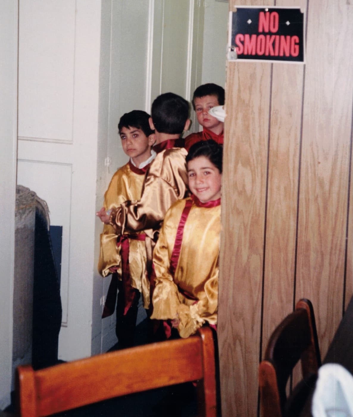 Ara as a boy, serving at church
