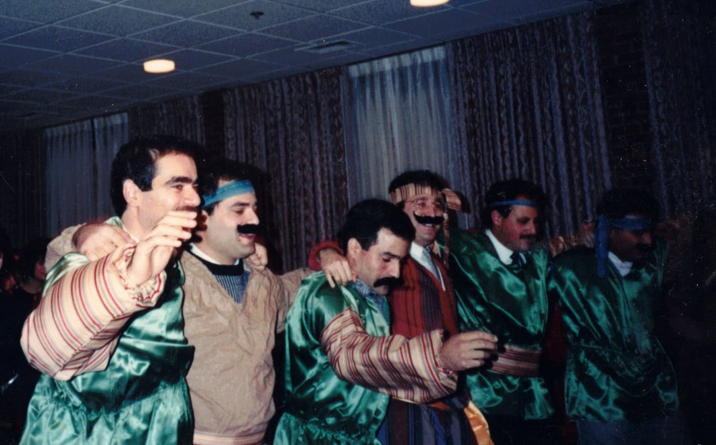 Men in Armenian costume dancing in a line
