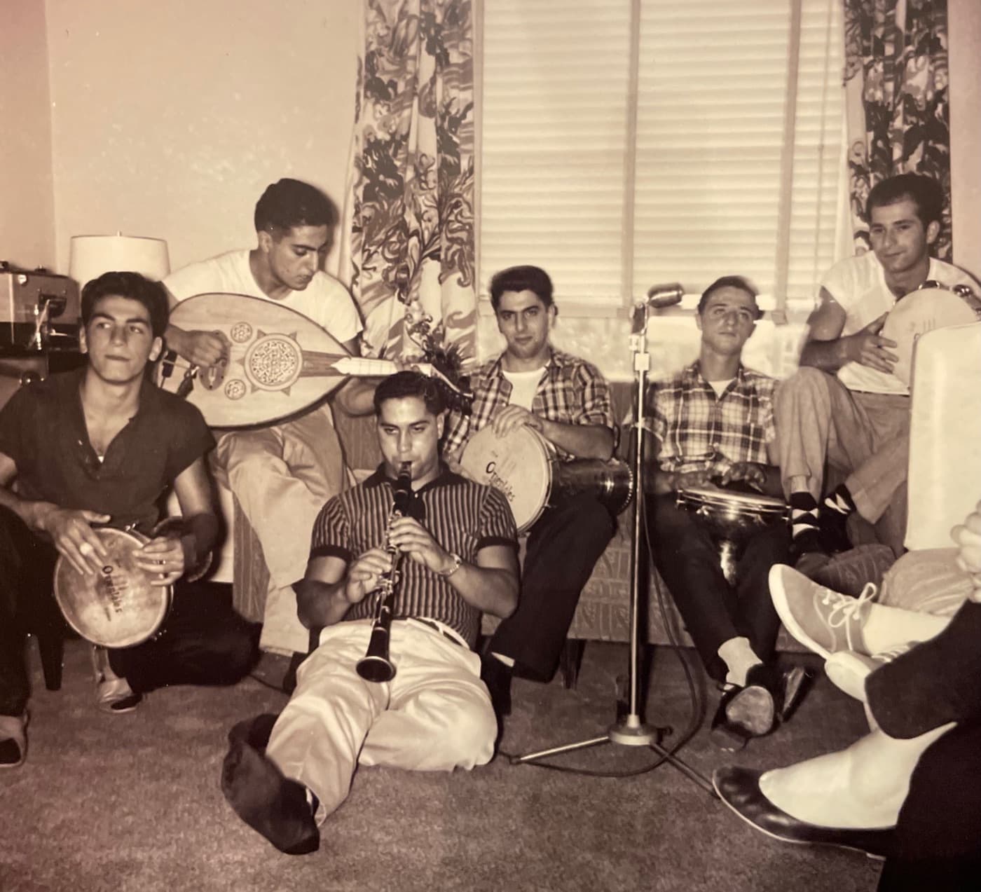 An Armenian kef band playing oud, clarinet and dumbeg in a living room